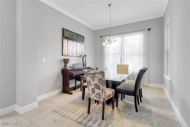 dining room featuring light tile patterned floors, a chandelier, and ornamental molding