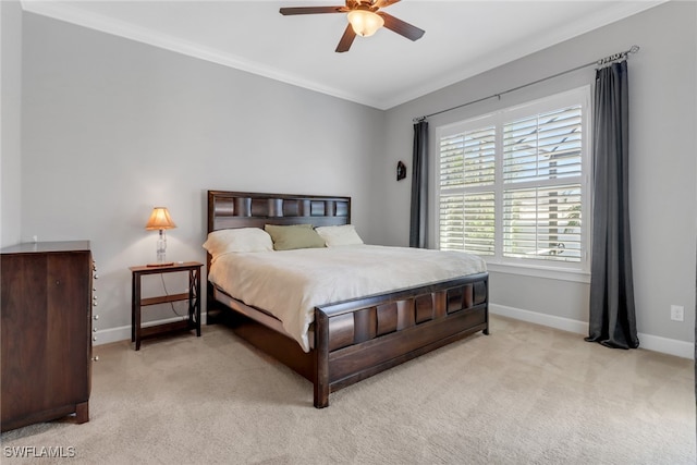 bedroom featuring ceiling fan, crown molding, and light carpet