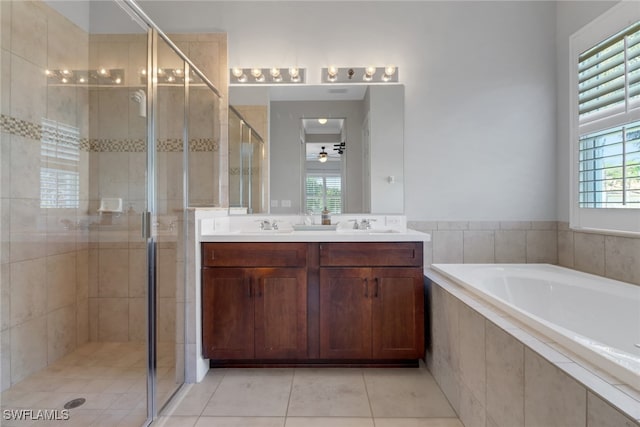 bathroom with tile patterned flooring, vanity, separate shower and tub, and ceiling fan