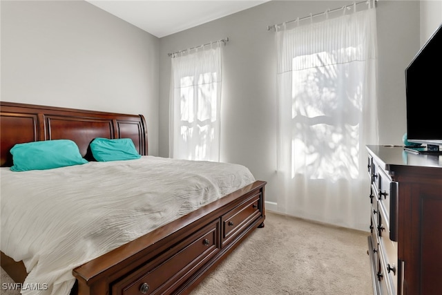 bedroom with light colored carpet