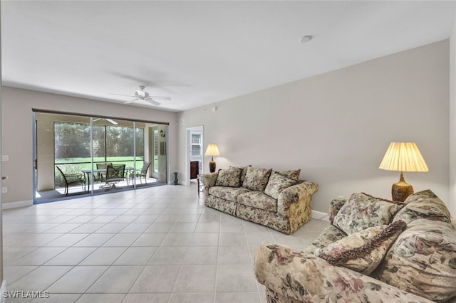 living room with ceiling fan and light tile patterned flooring