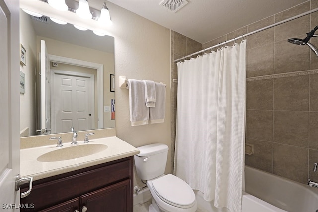 full bathroom featuring vanity, shower / bath combo, and toilet