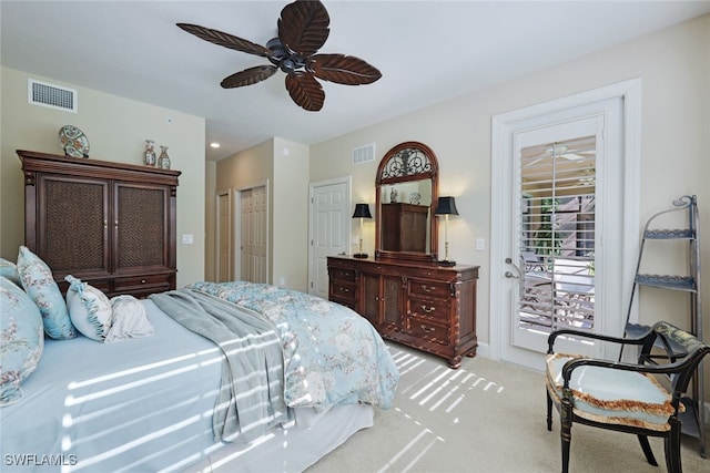 carpeted bedroom with ceiling fan and access to outside