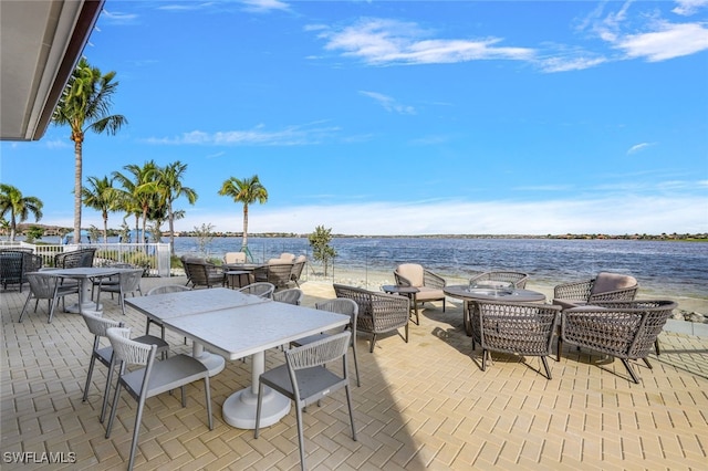 view of patio with a water view