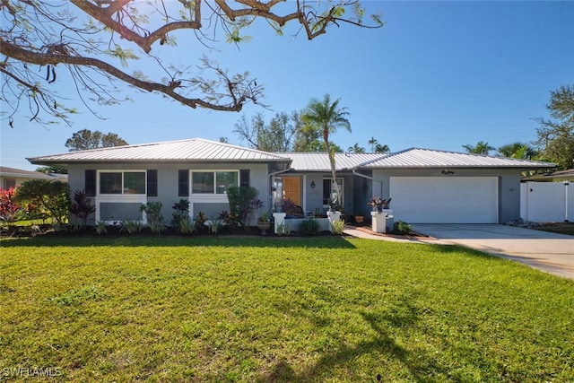 ranch-style home with a front yard and a garage