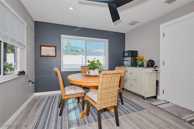 dining area with light wood-type flooring