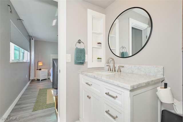 bathroom with vanity and hardwood / wood-style flooring