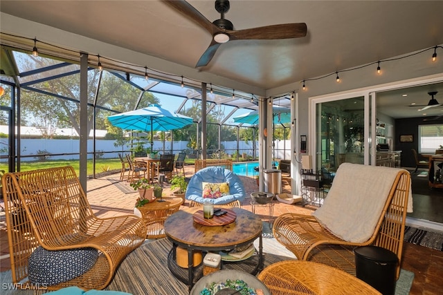 sunroom with plenty of natural light and ceiling fan