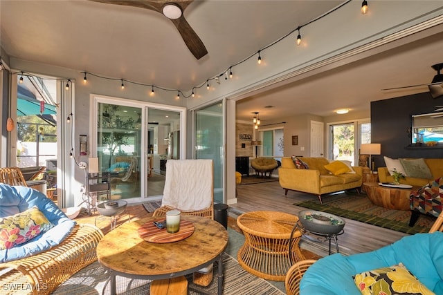 living room featuring hardwood / wood-style flooring and ceiling fan