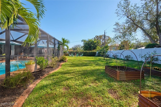 view of yard featuring glass enclosure and a fenced in pool