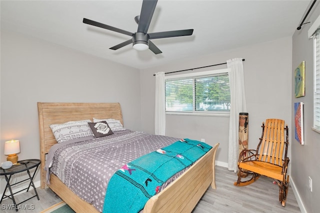 bedroom featuring ceiling fan and hardwood / wood-style flooring