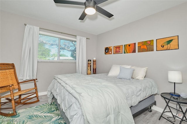 bedroom featuring ceiling fan and hardwood / wood-style floors