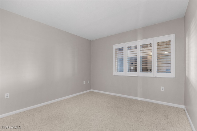 empty room with carpet flooring