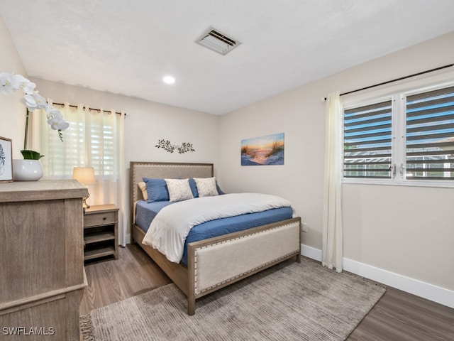 bedroom with wood-type flooring