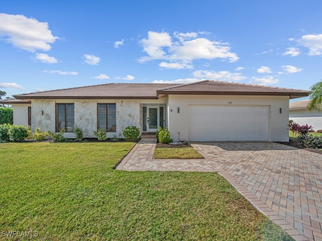 single story home with a garage and a front yard