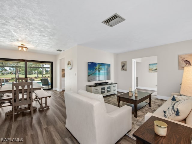 living room featuring dark hardwood / wood-style floors