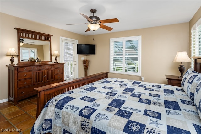 tiled bedroom with ceiling fan