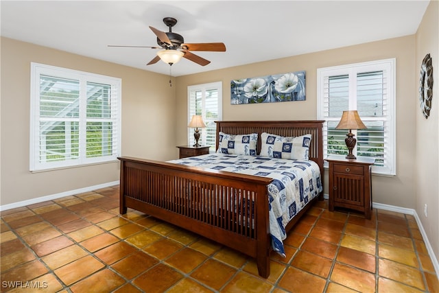 tiled bedroom with ceiling fan