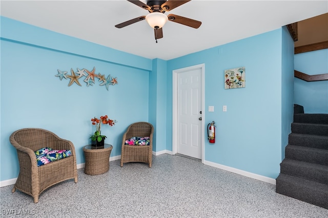 living area featuring ceiling fan