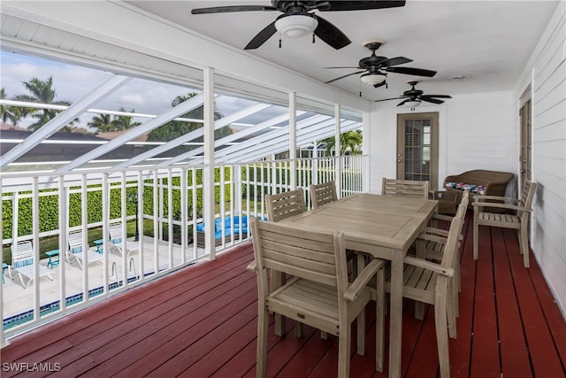 sunroom / solarium with ceiling fan