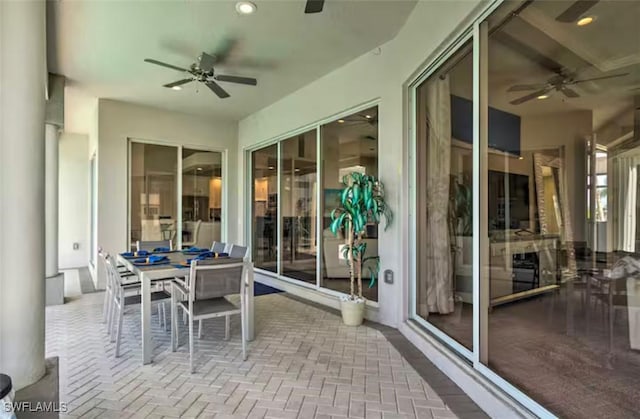 sunroom / solarium with ceiling fan