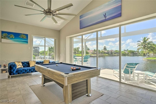 game room with ceiling fan, a water view, billiards, and vaulted ceiling