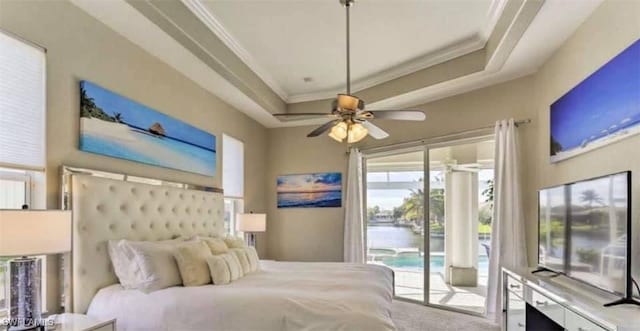 bedroom with access to outside, a raised ceiling, ceiling fan, and crown molding