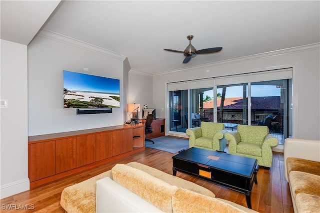 living room featuring ornamental molding, ceiling fan, and light hardwood / wood-style flooring