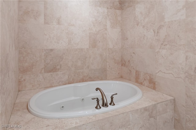 bathroom with tiled bath