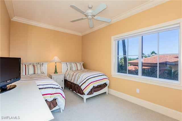 bedroom with ceiling fan, ornamental molding, and carpet