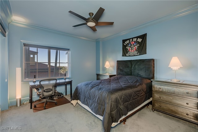 carpeted bedroom featuring ornamental molding and ceiling fan