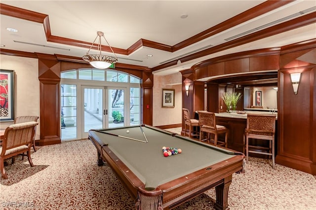 playroom featuring french doors, a tray ceiling, crown molding, and indoor bar