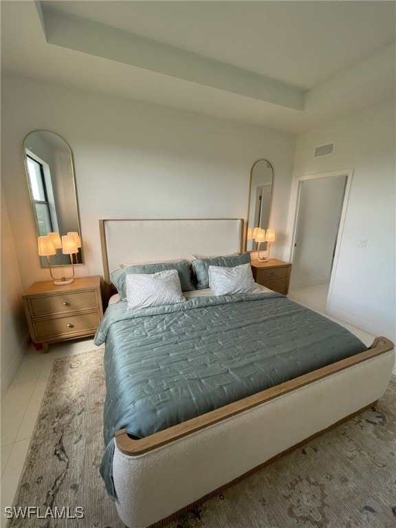 bedroom featuring light tile patterned floors