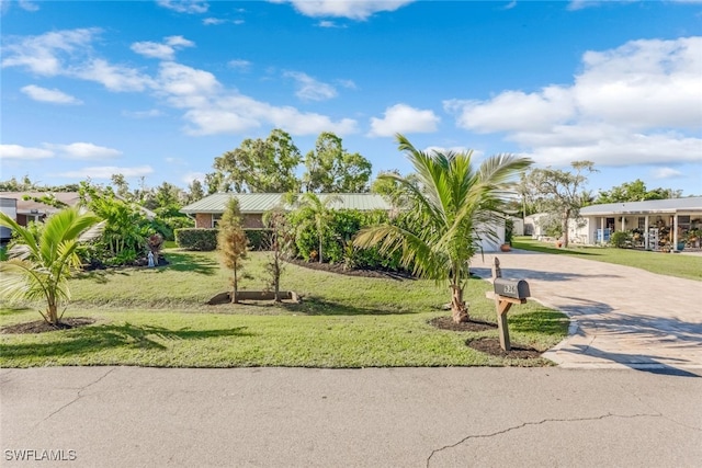 single story home featuring a front yard