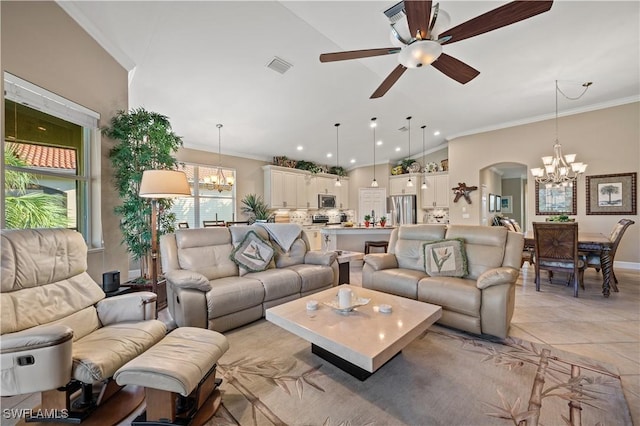 tiled living room with ceiling fan with notable chandelier and ornamental molding