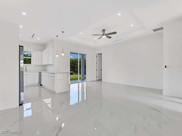 6006 Stratton Rd, Fort Myers, FL 33905 - unfurnished living room with plenty of natural light, a tray ceiling, light marble finish floors, recessed lighting, and ceiling fan
