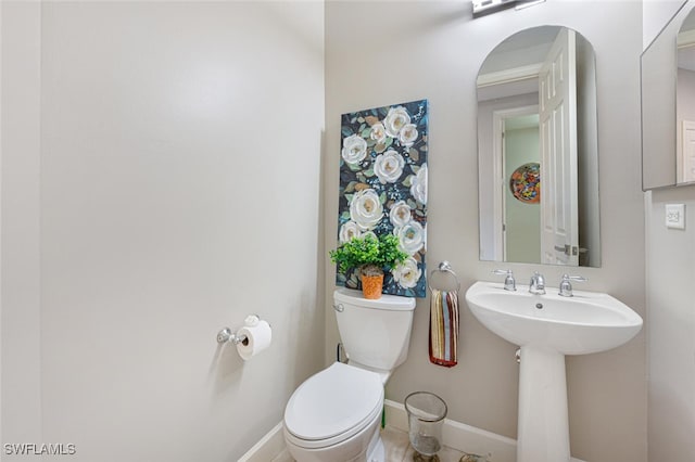 bathroom with sink and toilet