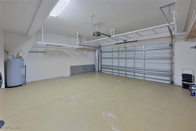 garage featuring electric water heater and a garage door opener