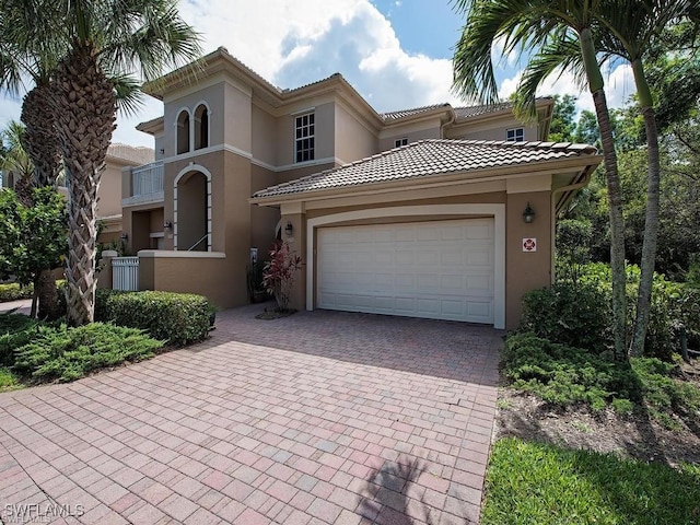 mediterranean / spanish-style house featuring a garage