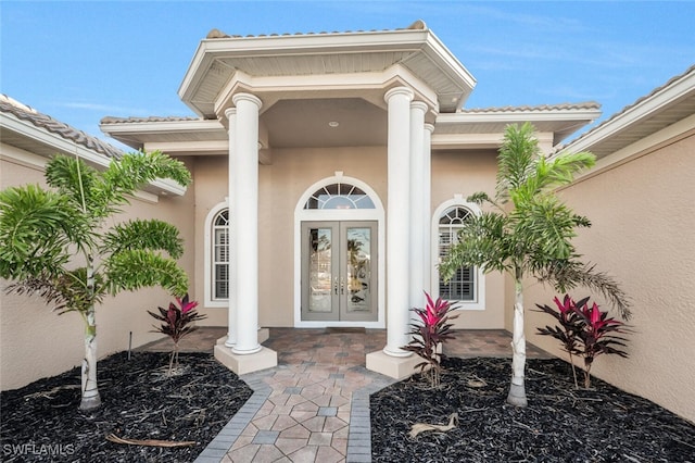 entrance to property featuring french doors