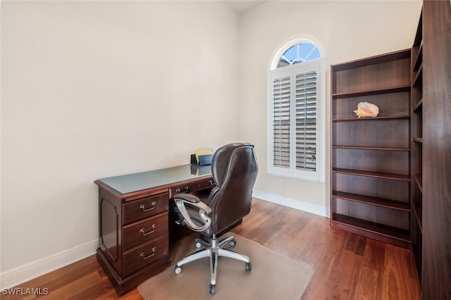 office space featuring dark wood-type flooring