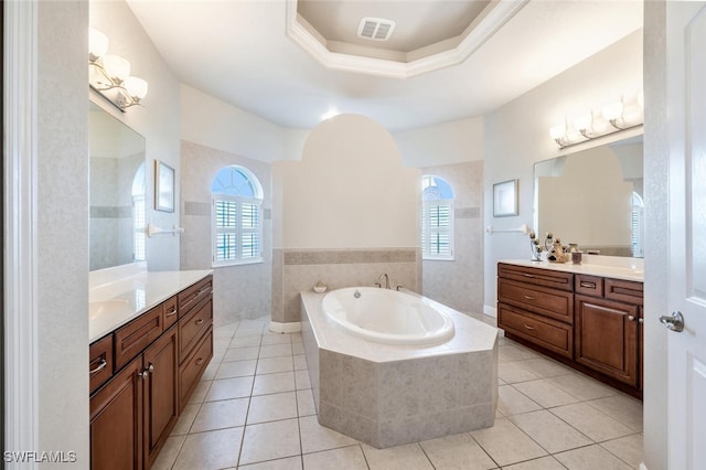 bathroom with shower with separate bathtub, tile walls, tile patterned flooring, vanity, and a raised ceiling