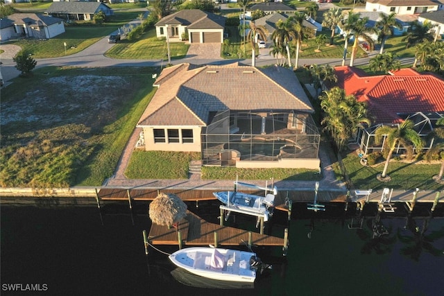 birds eye view of property featuring a water view