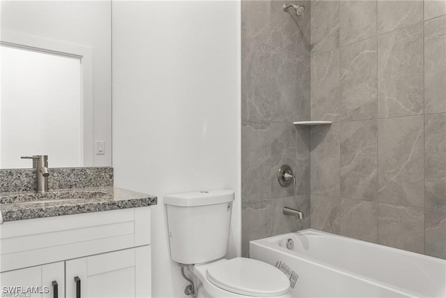 full bathroom featuring vanity, toilet, and tiled shower / bath