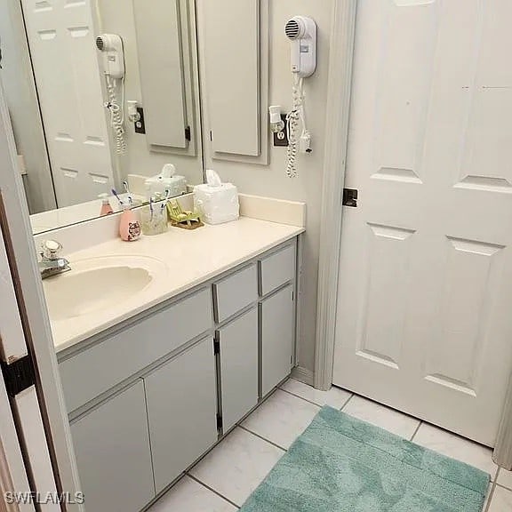 bathroom with tile patterned flooring and vanity