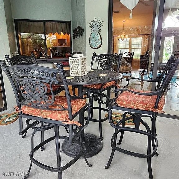 dining area with an inviting chandelier