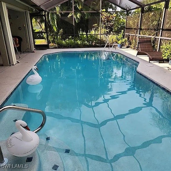 view of swimming pool with a patio area