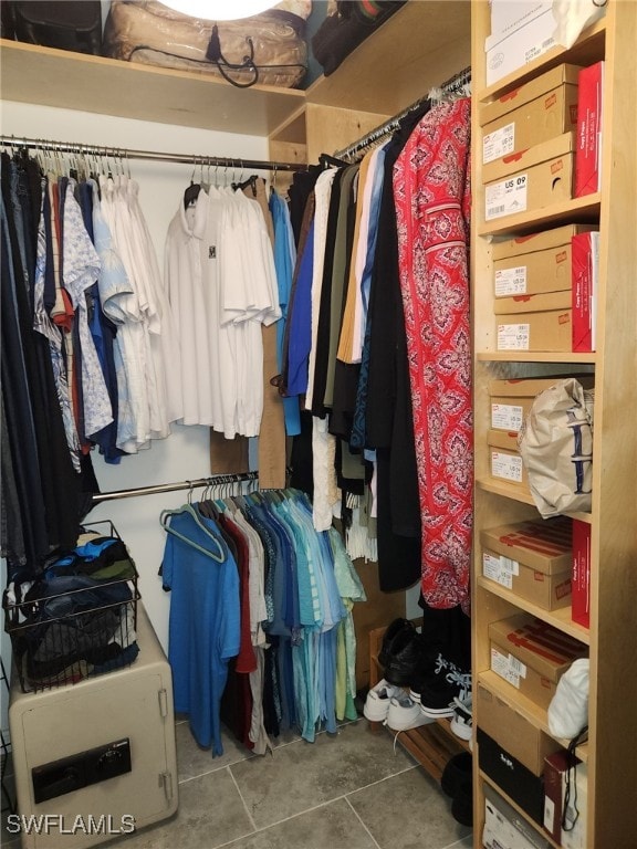 spacious closet with tile patterned floors