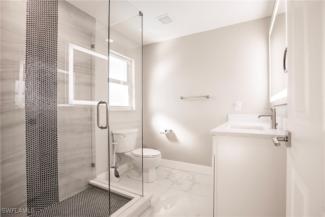 bathroom with an enclosed shower, vanity, and toilet