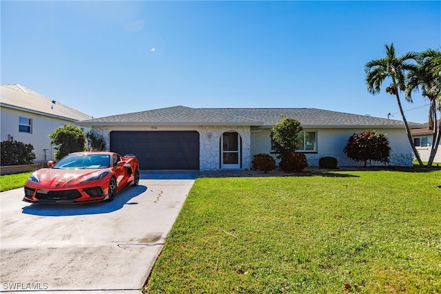 ranch-style house with a garage and a front lawn